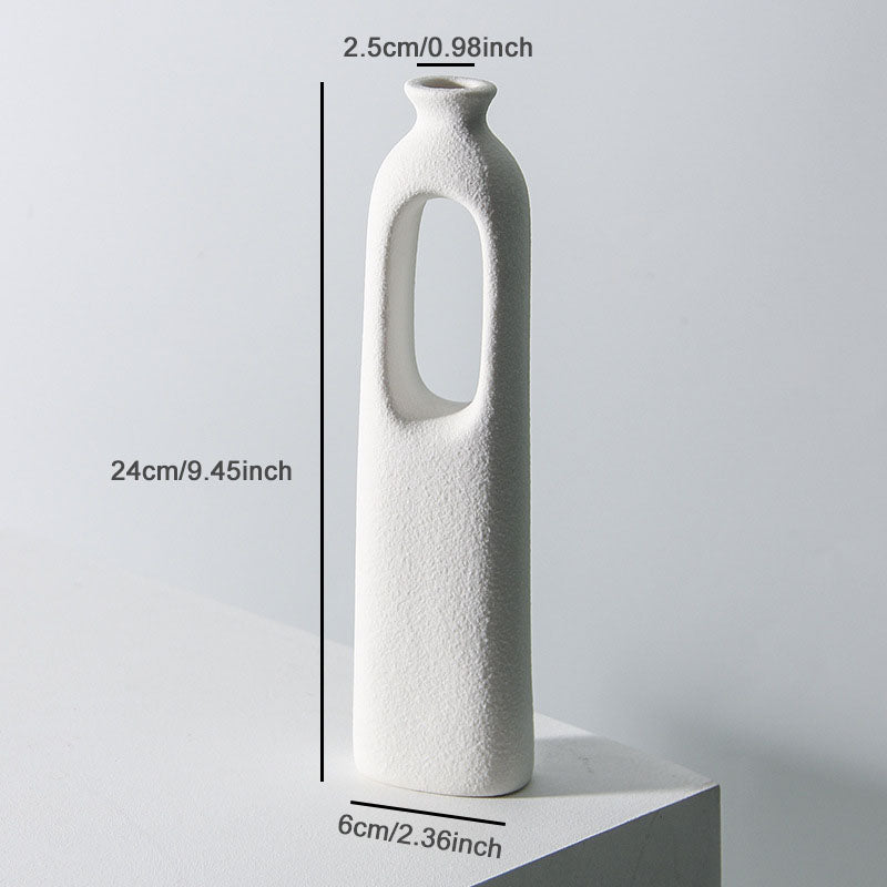 Vaso bianco alto 24 cm con forma allungata e apertura ovale
Copy alt text